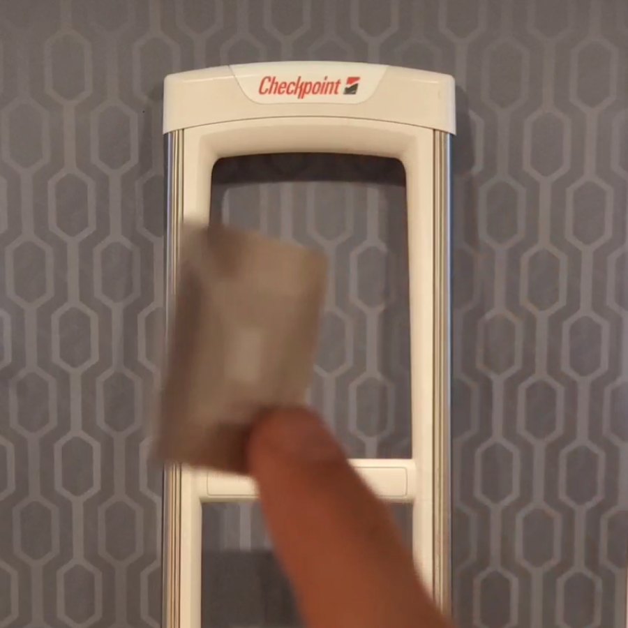 Soft RF label held in front of a test gate during an RF Deactivator demonstration.